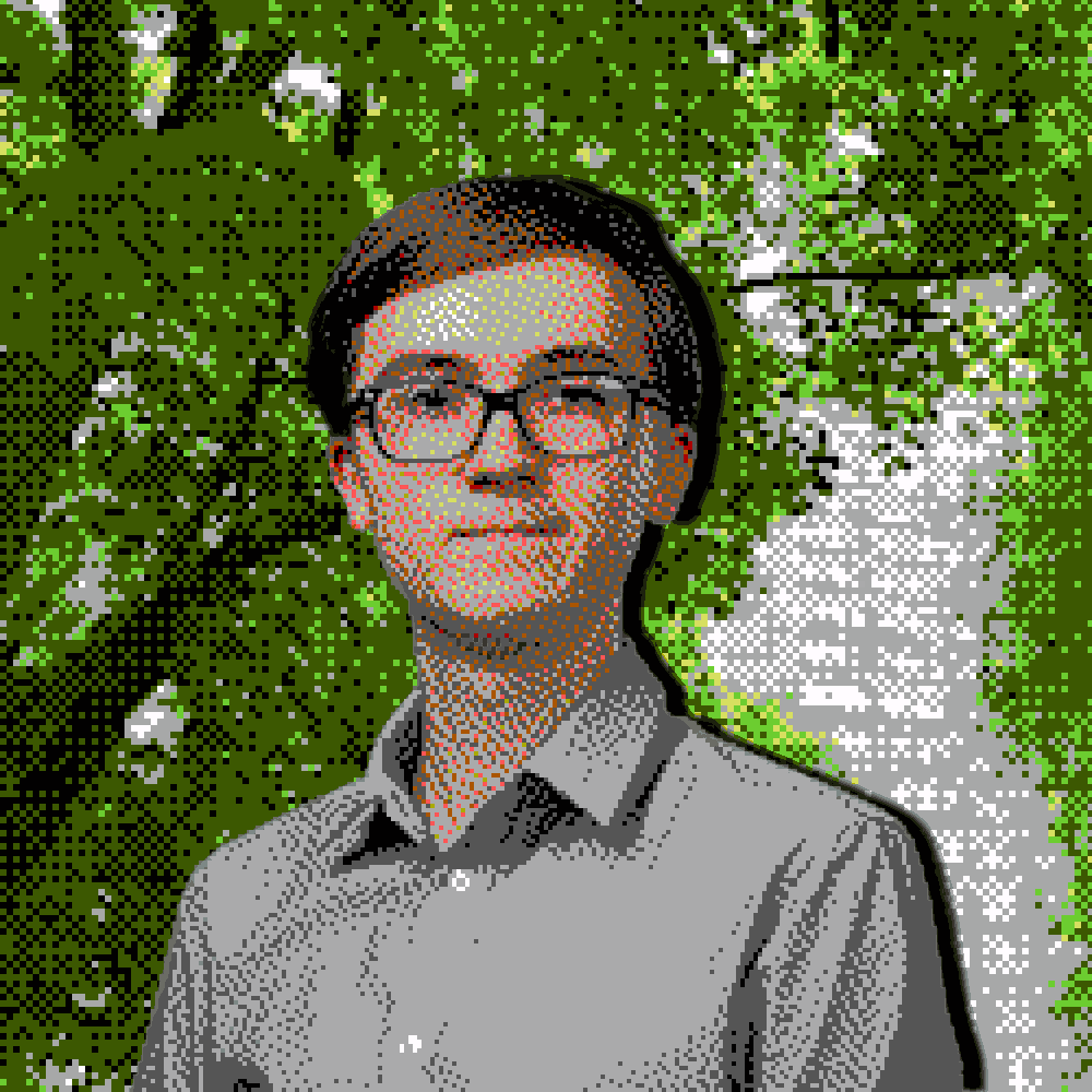 Jakub. A boy in late teens with brown hair, glasses, a gray linen shirt, and a subtle smile.